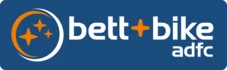 Logo mit Schrift "bett+bike" und "adfc" auf blauem Hintergrund, orangefarbene Sterne.